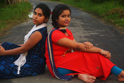 Portrait of friends sitting outdoors