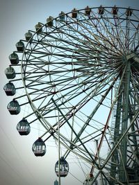 Low angle view of ferris wheel against sky