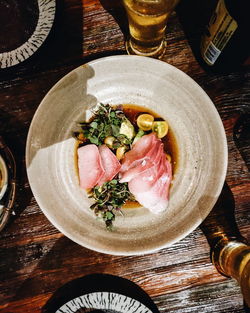 High angle view of fish in plate on table