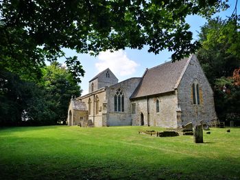 Church on field against sky