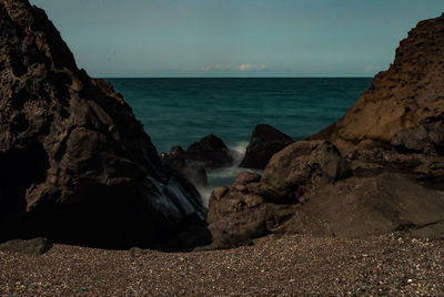 Scenic view of sea against dramatic sky