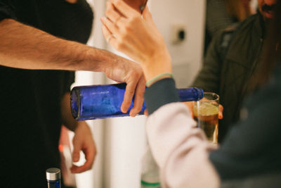 Close-up of man holding drink