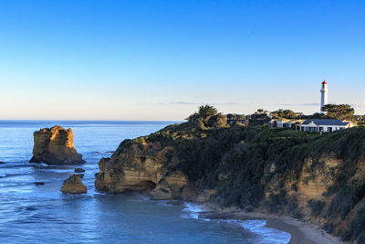 Scenic view of sea against clear blue sky