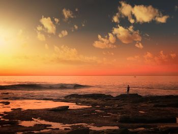 Scenic view of sea against sky during sunset