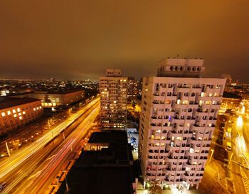 High angle view of illuminated buildings in city at night