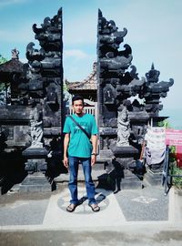 Full length portrait of man walking in temple