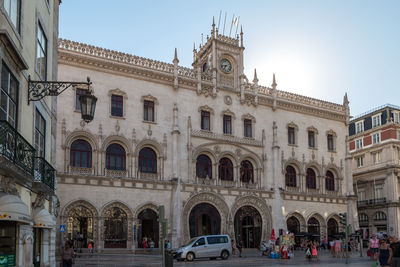 Group of people in front of historical building