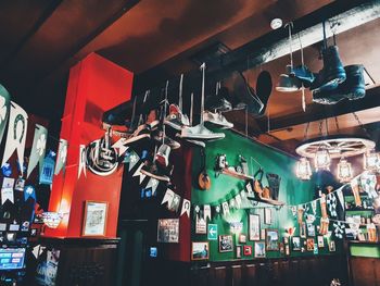 Low angle view of illuminated lamps hanging in store