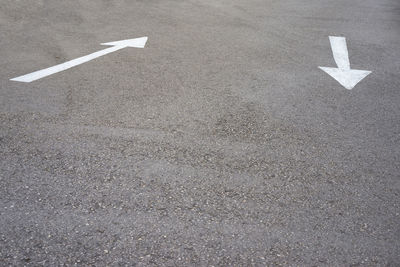 High angle view of arrow symbols on street