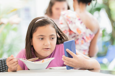 Portrait of girl holding food