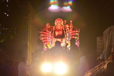 Low angle view of fireworks at night