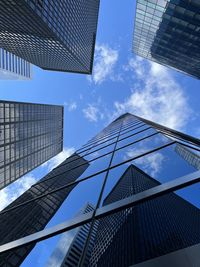 Low angle view of modern buildings against sky