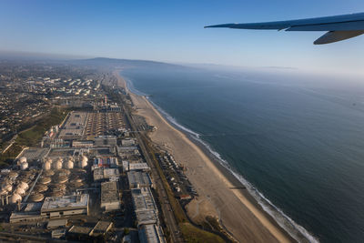Photo from an airplane of los angeles and the sea beach at pacific ocean