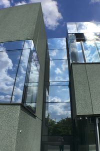 Low angle view of building against cloudy sky