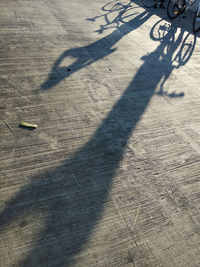 Shadow of person on bicycle