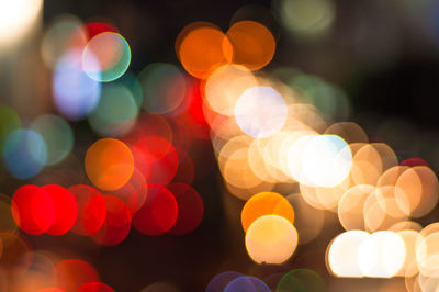 Defocused image of illuminated lights at night