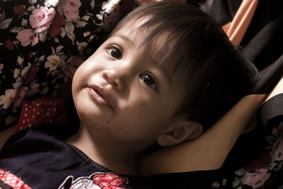 Portrait of cute girl lying down