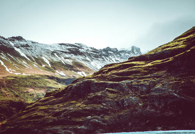 Scenic view of snowcapped mountains against sky