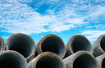 Steel wire coil against blue sky. metal steel reinforced for concrete construction. iron wire.