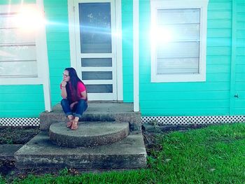 Full length of woman standing on grass