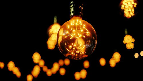 Close-up of illuminated light bulb
