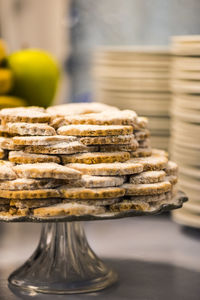 Close-up of cookies arranged on stand at table