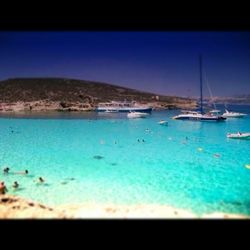 Scenic view of sea against blue sky