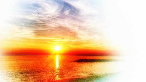 Scenic view of calm sea at sunset