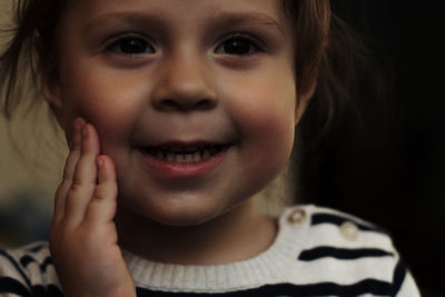 Close-up portrait of smiling girl