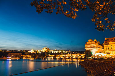 Illuminated buildings at waterfront