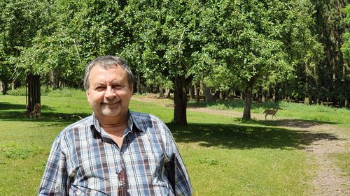 Portrait of man standing in park