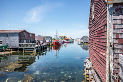 Peggy's cove, nova scotia, canada. beautiful summer day with clear blue skies, calm ocean waters.