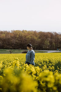 Rear view of person standing on field