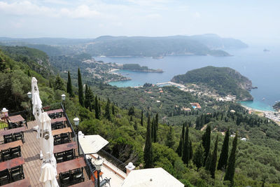 High angle view of townscape by sea against sky