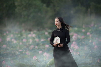 Young woman standing outdoors