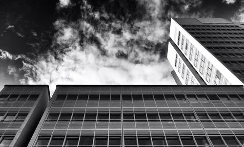 Low angle view of building against cloudy sky