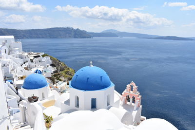 Panoramic view of church and buildings against sky. oia, santorini, greece 