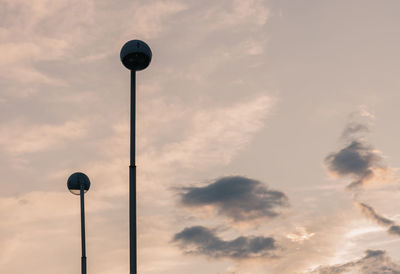 Low angle view of street light against sky