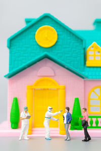 Full frame shot of yellow toys on building