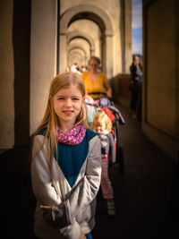 Portrait of smiling girl standing outdoors