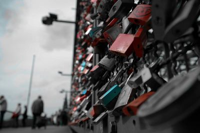 Padlocks on bridge railing