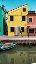 Boats moored in canal