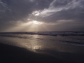 Scenic view of beach against sky during sunset