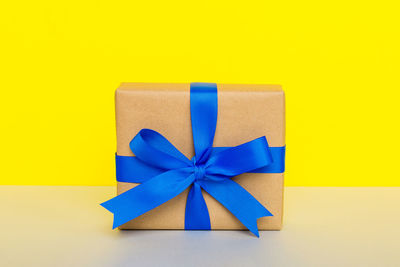 Close-up of gift box on red background