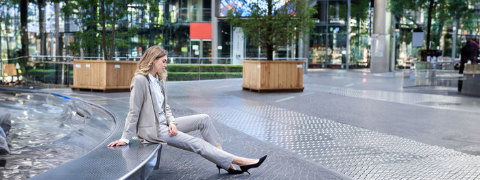 Low section of woman walking on street