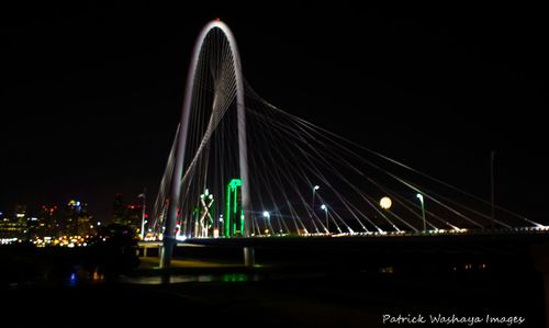 Low angle view of illuminated ferris wheel