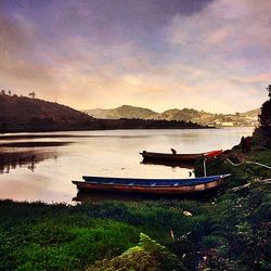 Scenic view of lake against cloudy sky