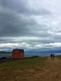View of beach against cloudy sky