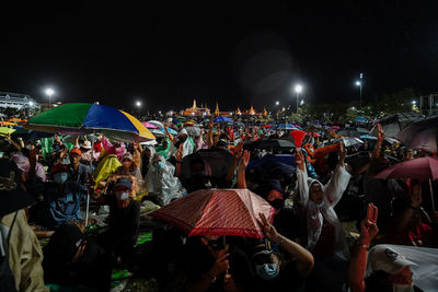 Group of people in market at night