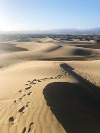 Scenic view of desert against clear sky